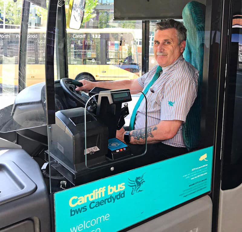 A driver of Cardiff Bus sitting in his cab.